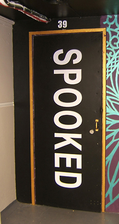 Spooked door sign for book launch of Spooked exploring the paranormal in new Zealand at Mygalaxi Gallery, 39 Dixon St Wellington